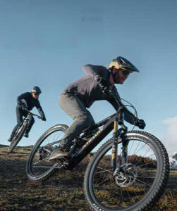 Two Electric mountain bikes and riders