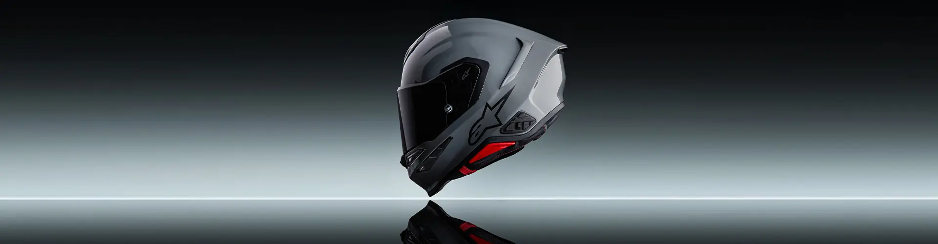 Grey full-face motorcycle helmet with dark visor